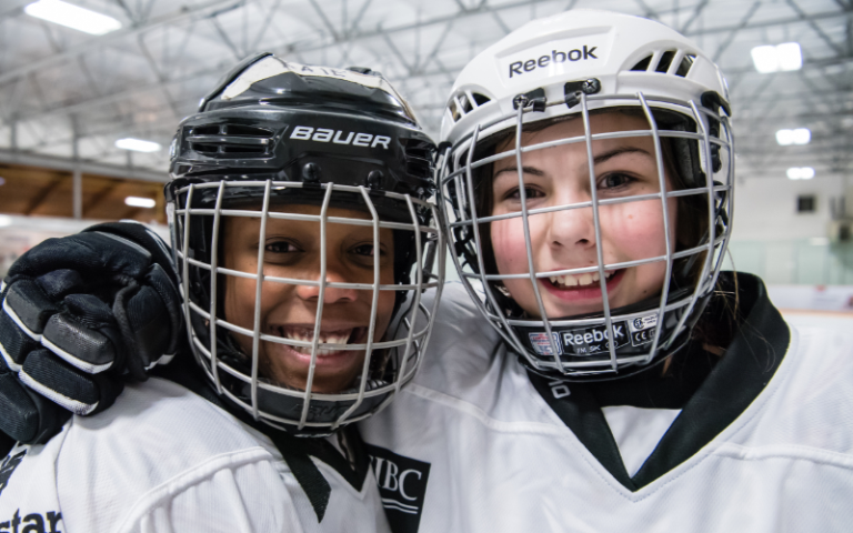 young hockey players shoulder to shoulder